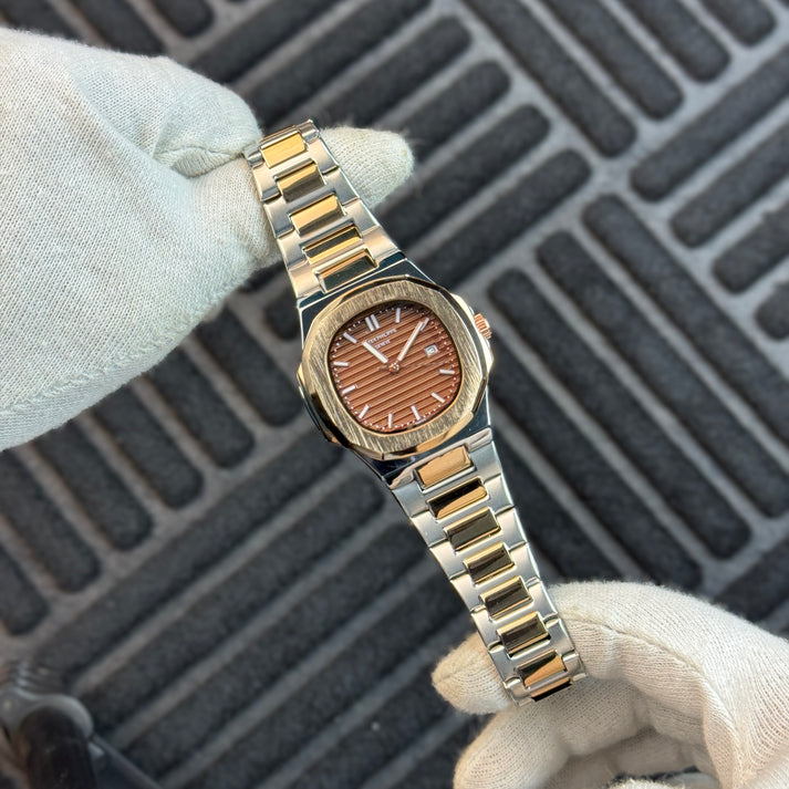 Patek Philippe - Nautilus -
Two Tone Gold